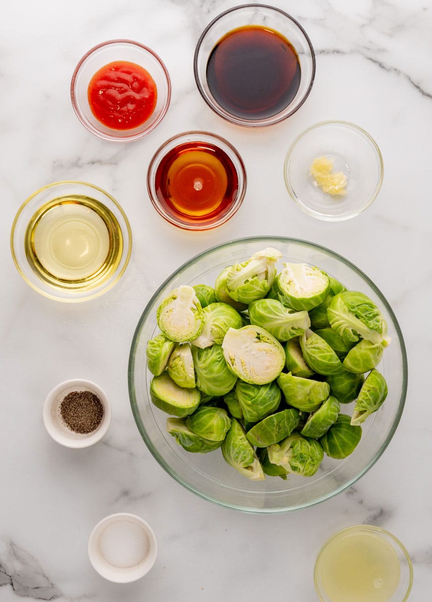 an overhead image showing the measured ingredients needed to make a batch of crispy soy glazed brussels sprouts