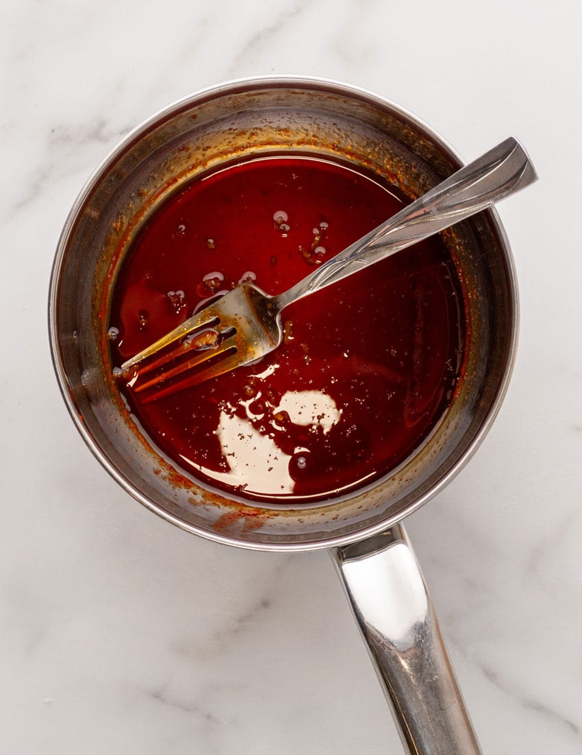 a homemade soy sauce based Asian glaze in a small metal sauce pan