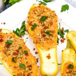 pimento cheese stuffed squash on a white serving platter