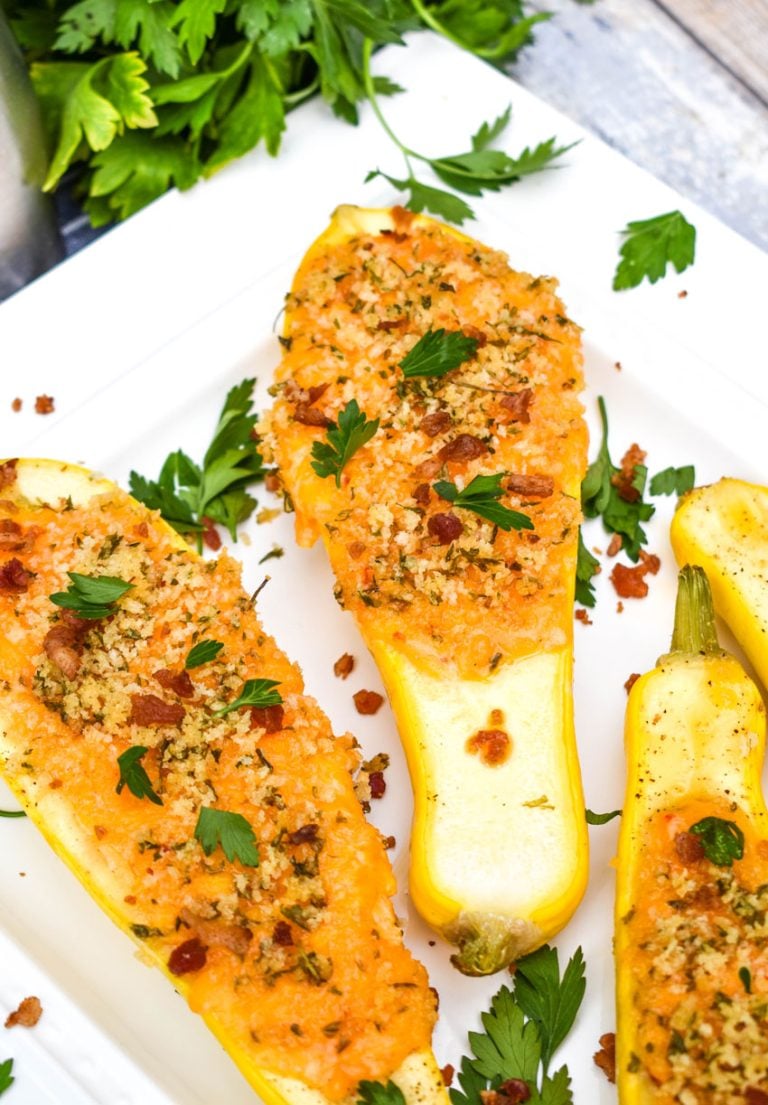 pimento cheese stuffed squash on a white serving platter