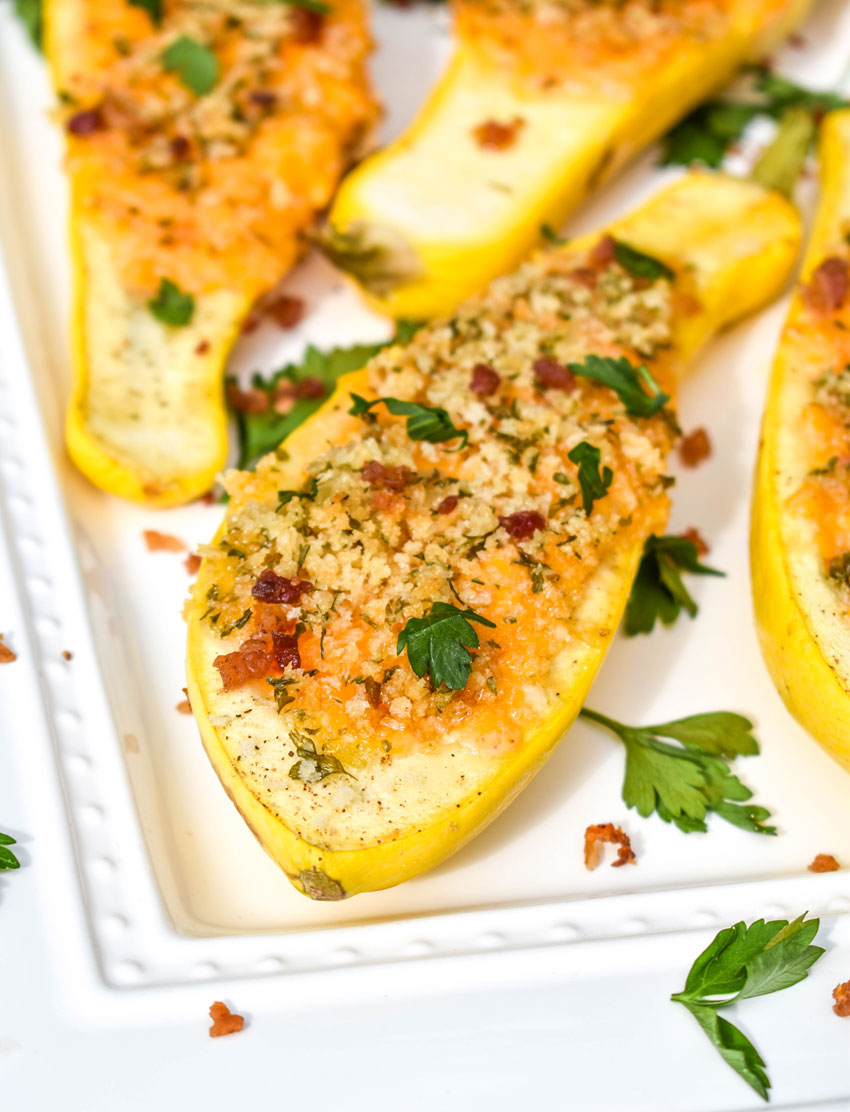 pimento cheese stuffed squash on a white serving platter