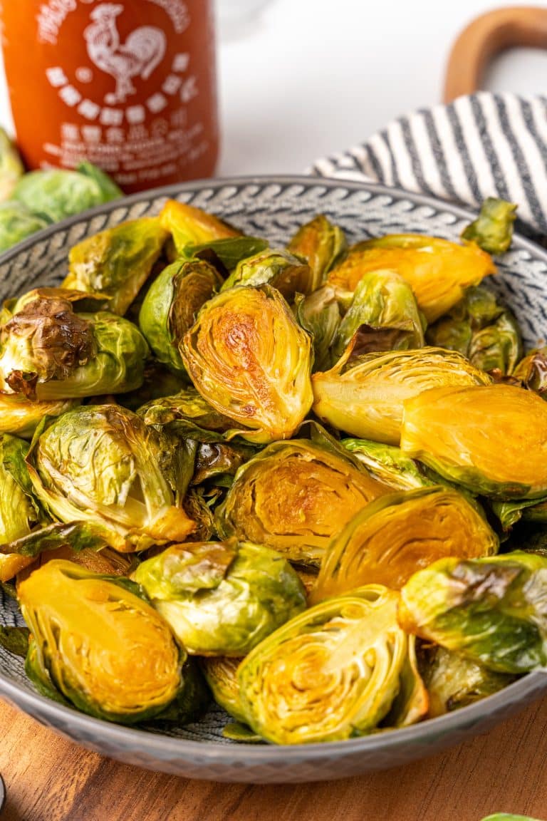 maple sriracha brussels sprouts in a gray bowl