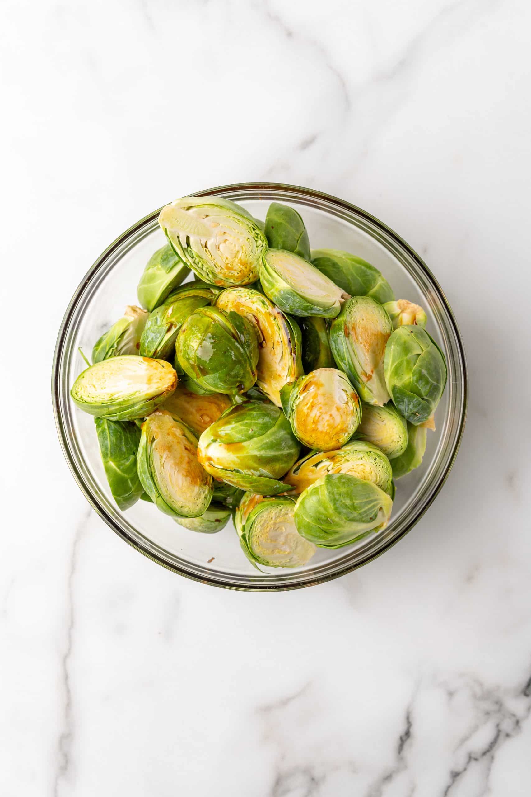 brussels sprouts in a large glass mixing bowl
