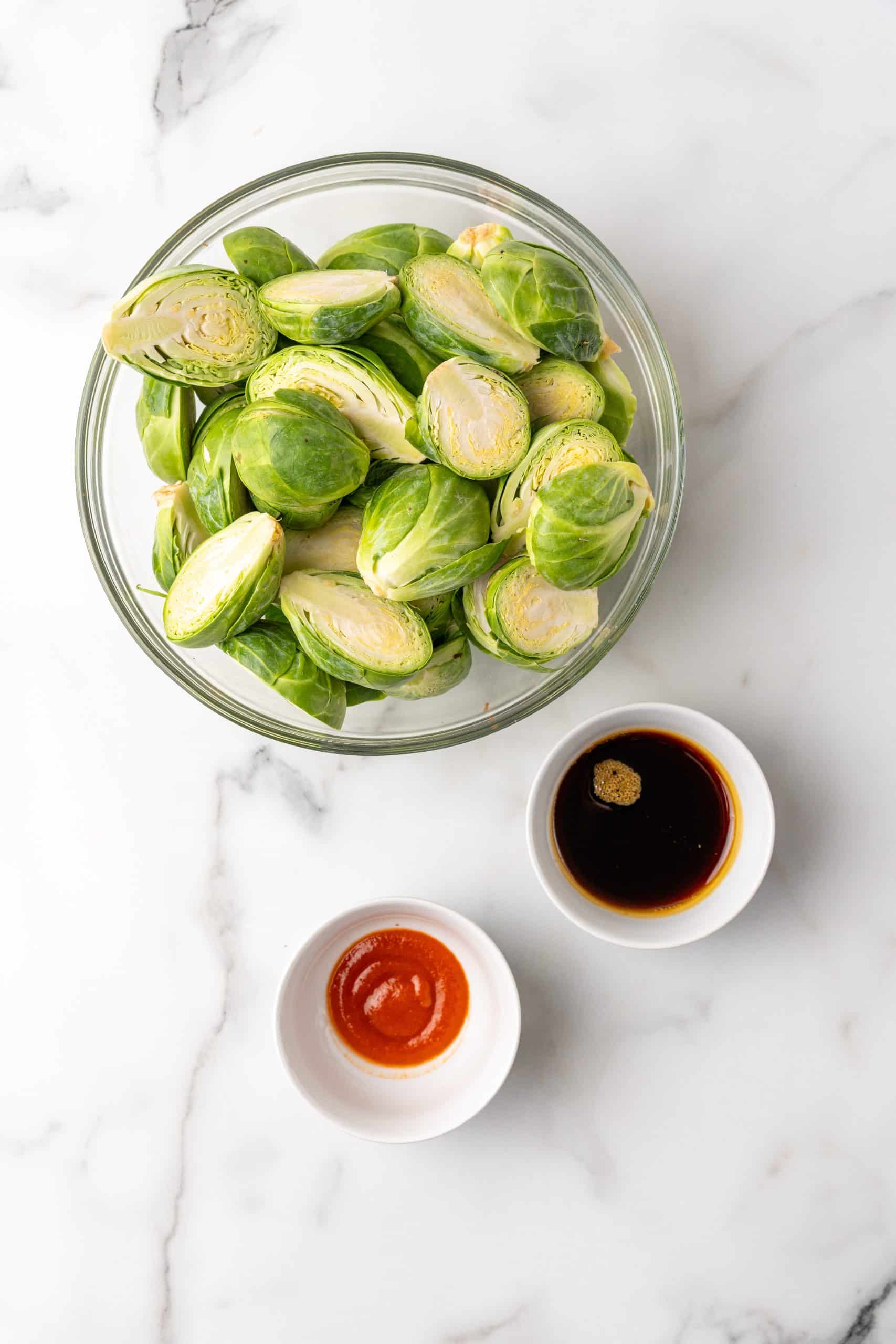 an overhead image showing the measured ingredients needed to make maple sriracha brussels sprouts