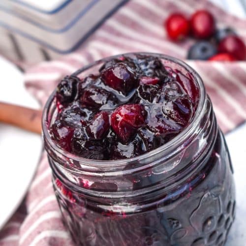 cabernet cranberry blueberry sauce in a small glass jar