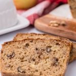 slices of fresh apple walnut bread shown on a white background