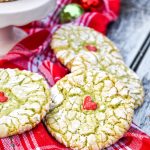 grinch cookies on a red cloth napkin