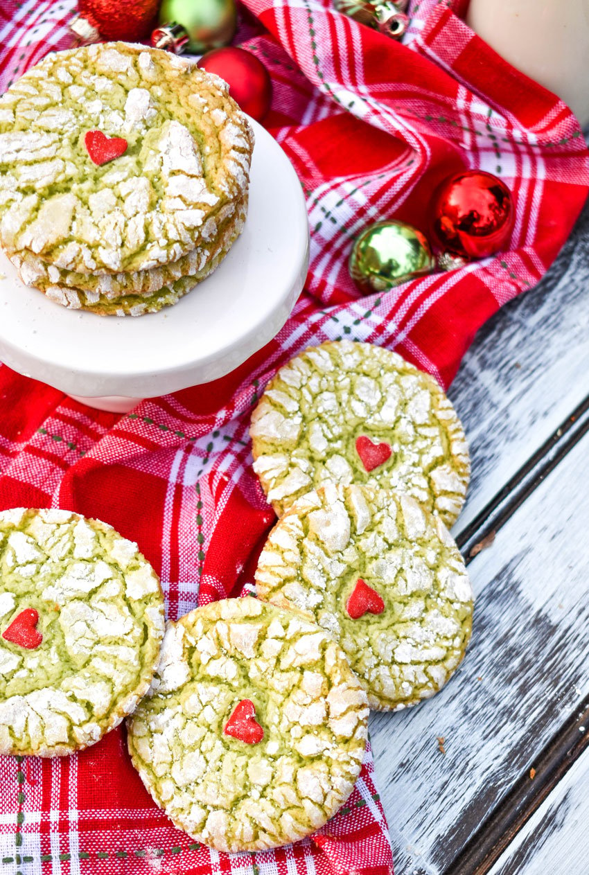grinch cookies on a red cloth napkin