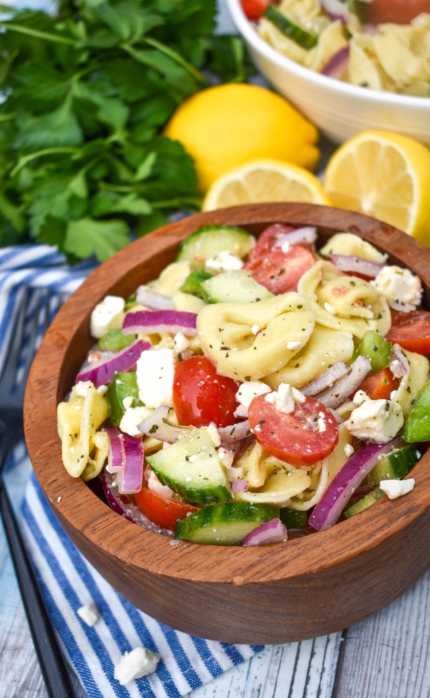 mediterranean tortellini pasta salad in a wooden bowl