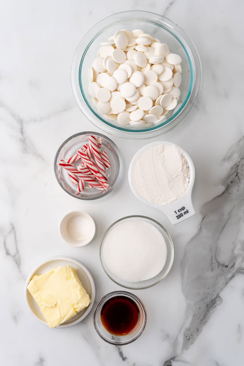 an overhead image showing the measured ingredients needed to make a batch of peppermint sugar cookie bark