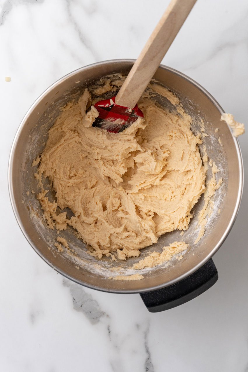 homemade sugar cookie dough in a metal mixing bowl