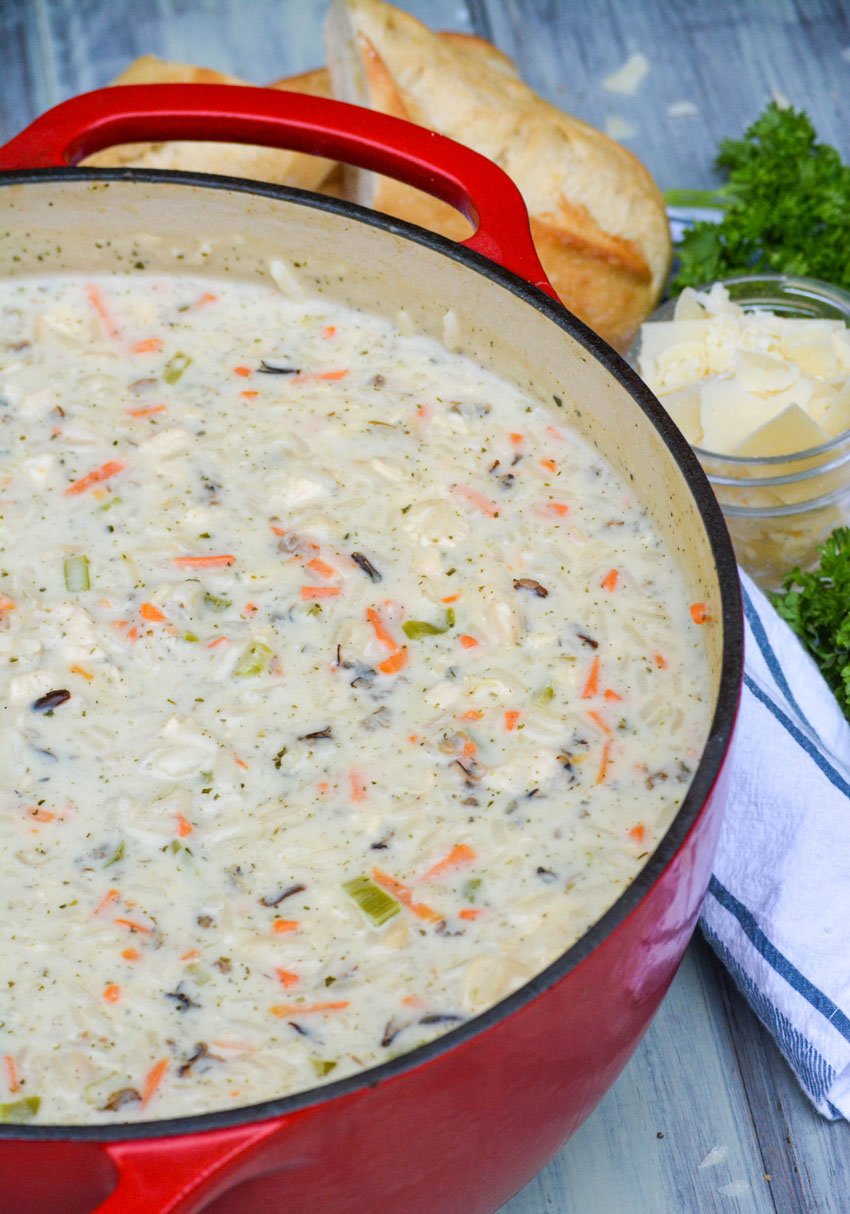 creamy chicken and wild rice soup in a large red dutch oven