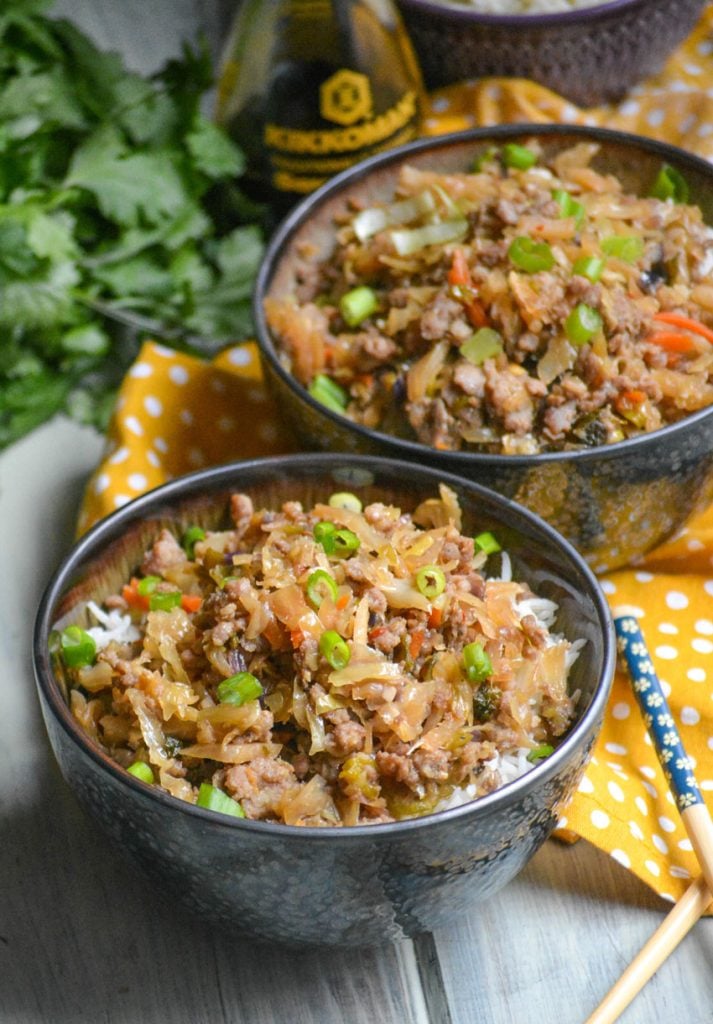 pork egg roll bowl shown with chop sticks 