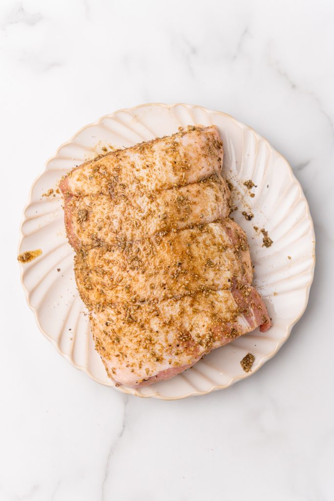 seasoned pork loin for mexican tacos on a white plate