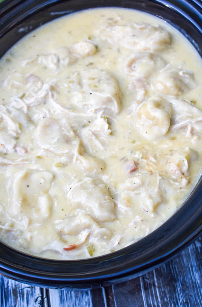 slow cooker chicken and dumplings in a black crock