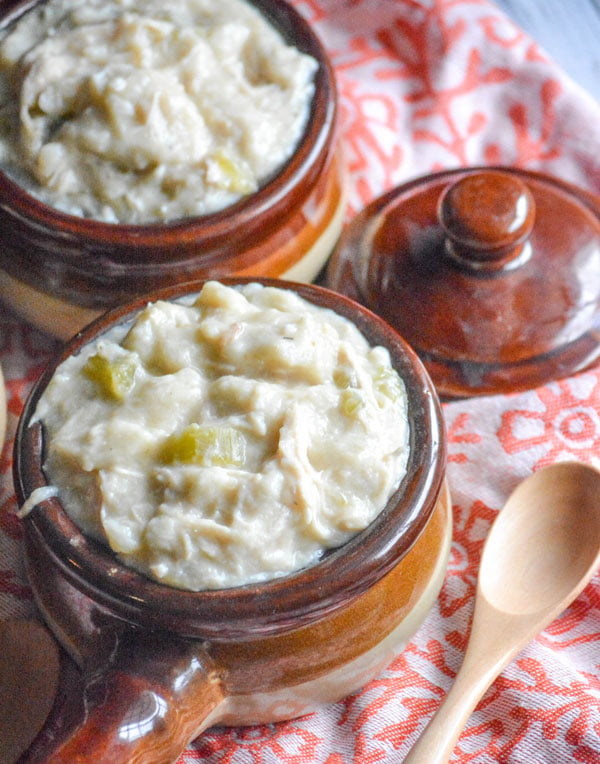 Slow Cooker Chicken & Dumplings served in brown stoneware bowls