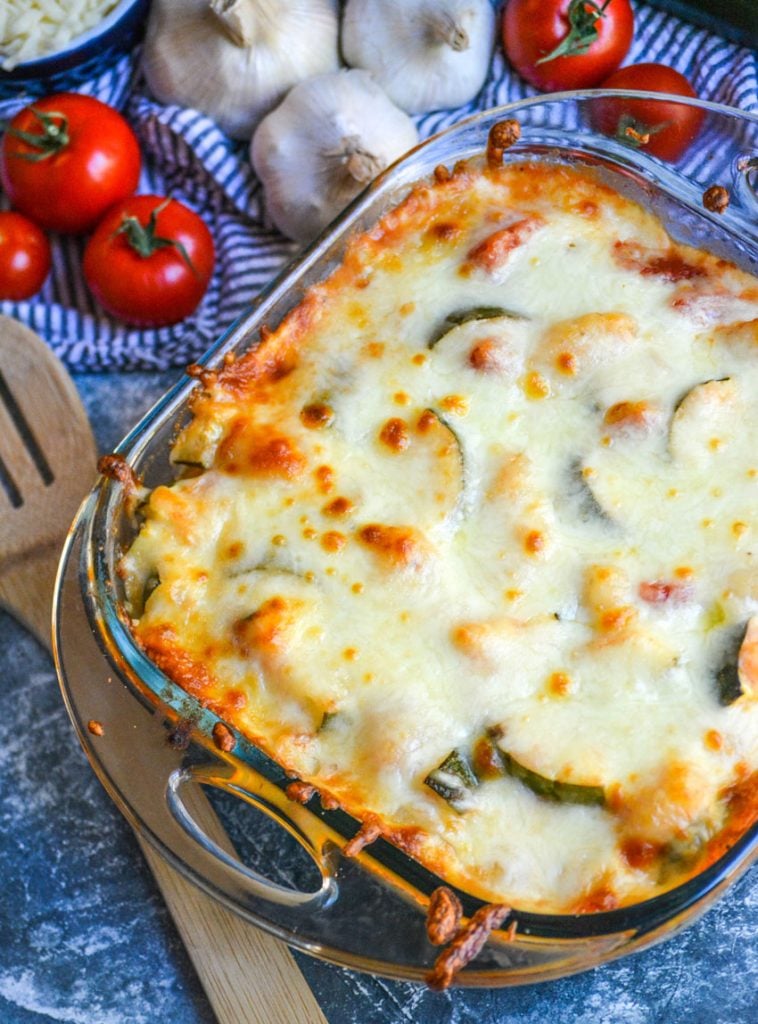 baked gnocchi with zucchini & tomatoes in a square pyrex baking dish