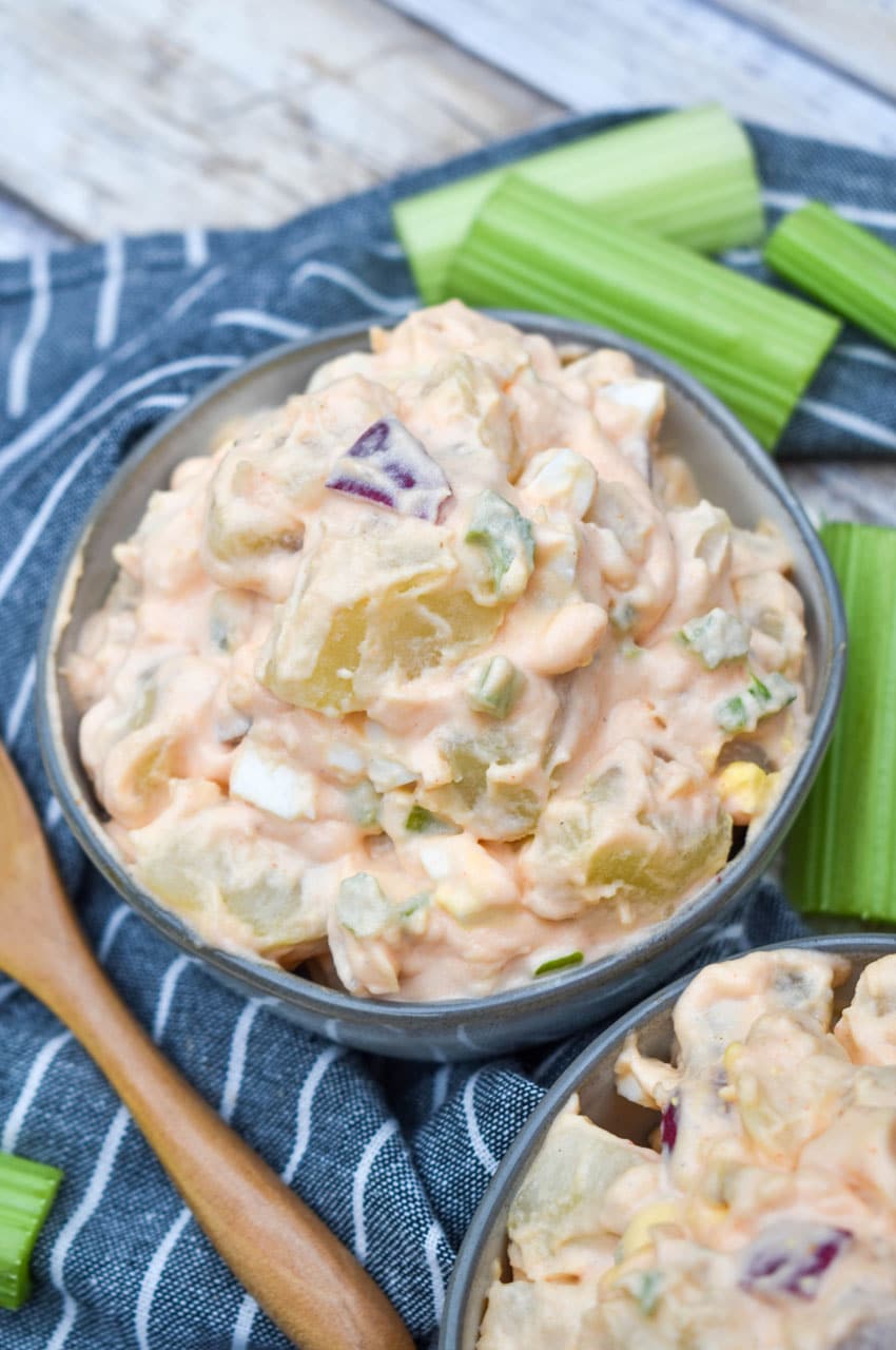 buffalo potato salad in two small gray bowls