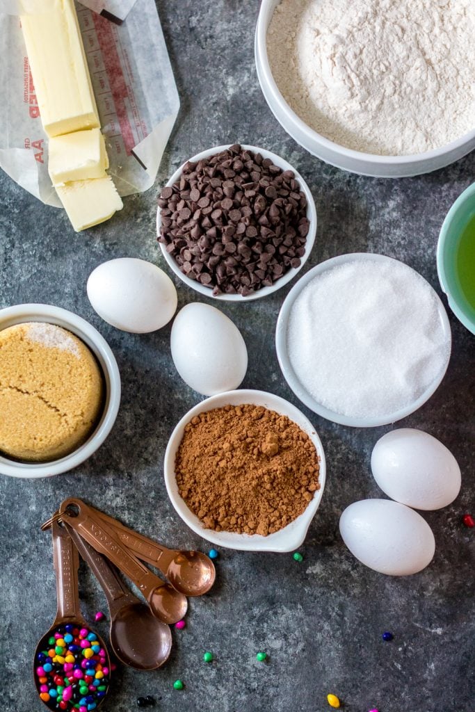 picture showing the ingredients needed to make a batch of cosmic brownies laid out on a wooden back drop