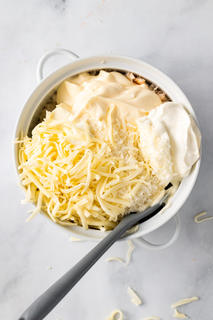 ingredients in a white bowl with a gray spoon