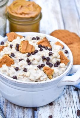 peanut butter cookie overnight oats in a bowl topped with crumbled cookies and miniature chocolate chips