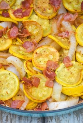 sauteed summer squash with onions & bacon in a blue cast iron enameled skillet
