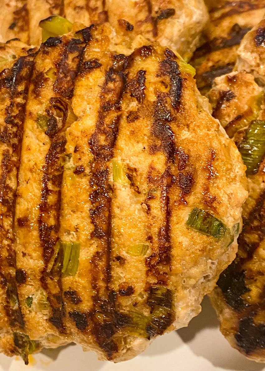 grilled tandoori chicken patties on a white plate