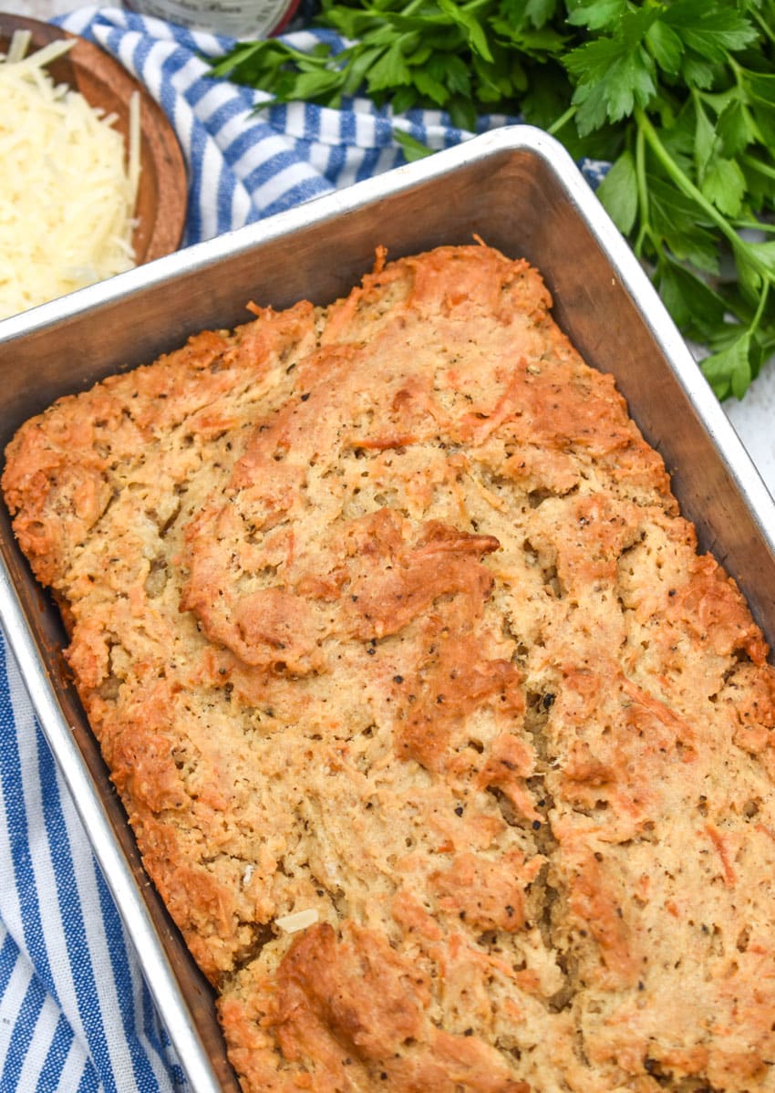 black pepper parmesan beer bread in a metal loaf pan