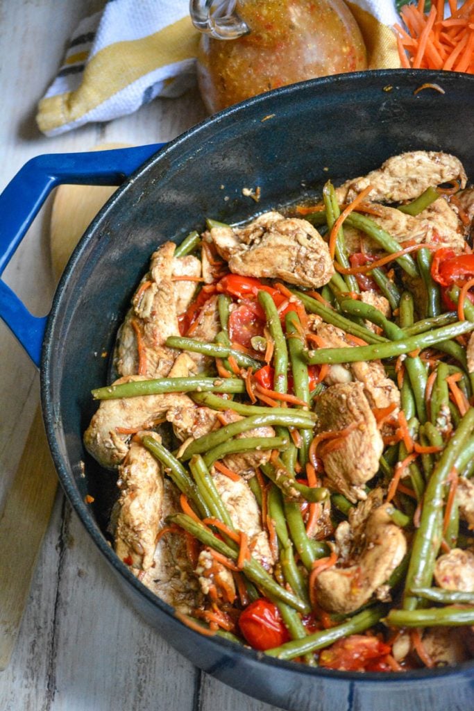 one pot balsamic chicken and veggies shown in a blue pot