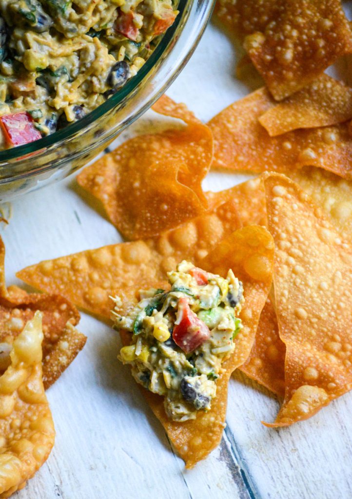 Southwestern egg roll dip shown on a crispy wonton chip