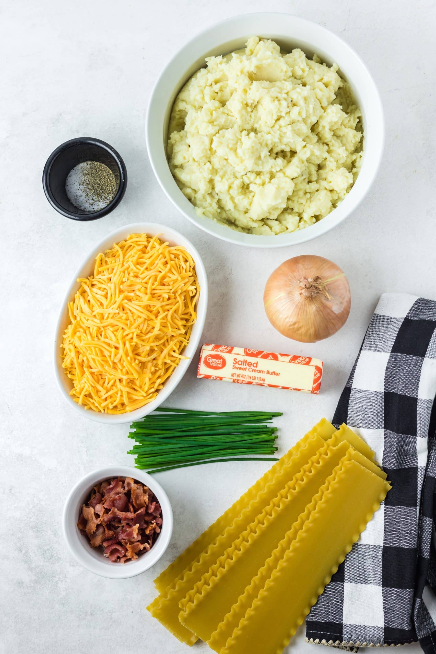 an overhead image showing the measured ingredients needed to make a pierogi lasagna