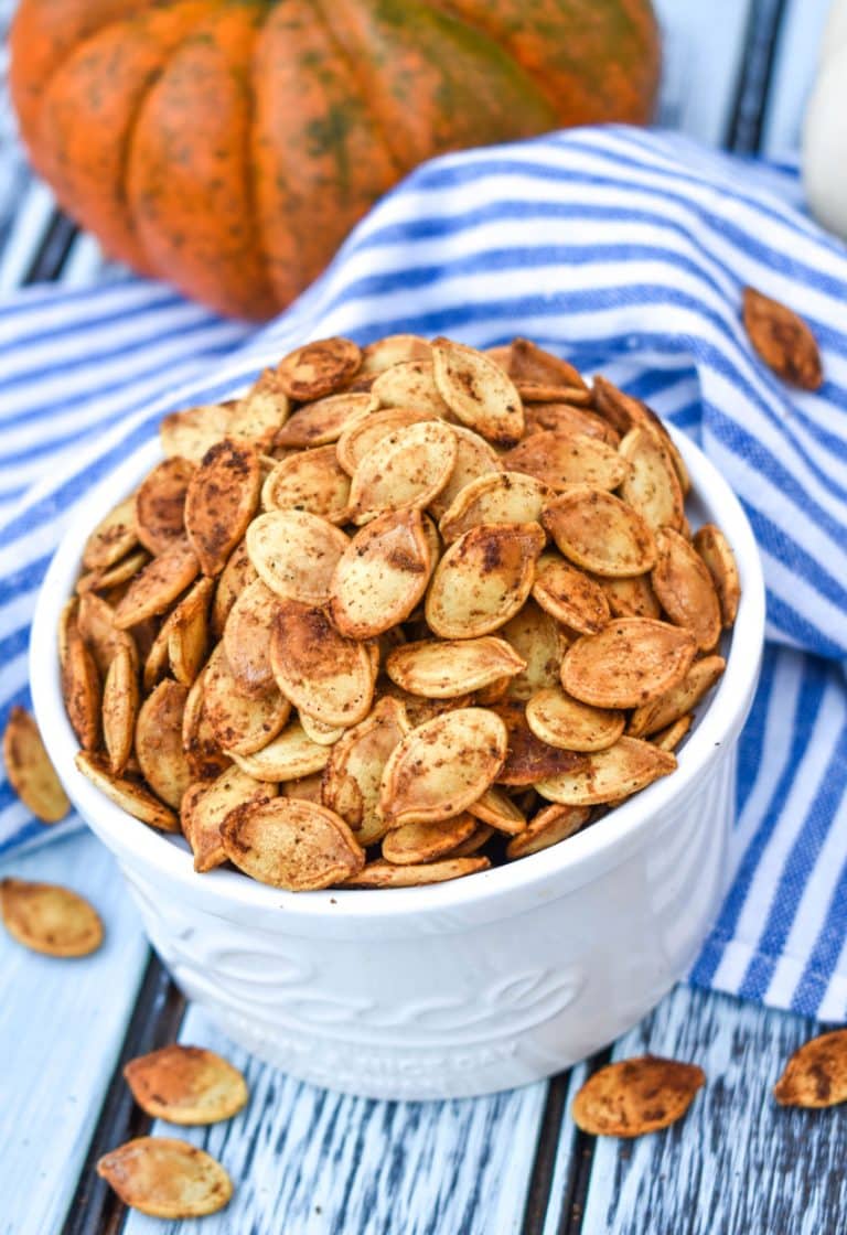 cajun pumpkin seeds in a small white bowl