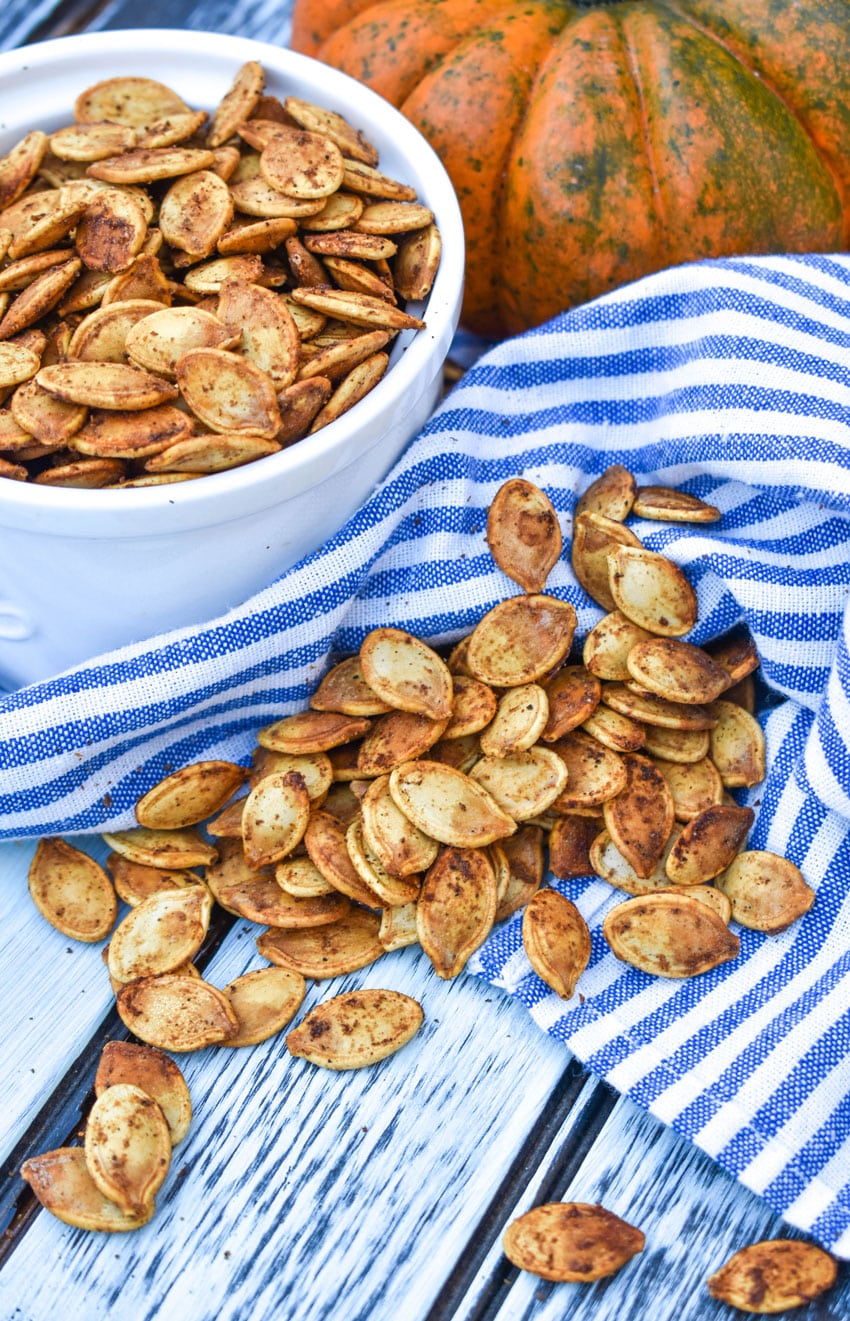 easy roasted pumpkin seeds on a wooden table