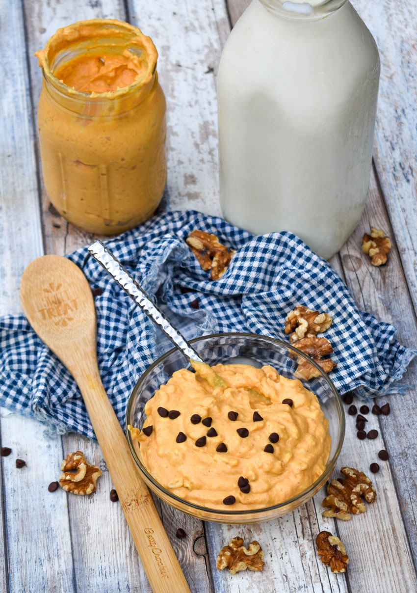pumpkin pie overnight oats in a glass bowl topped with mini chocolate chips