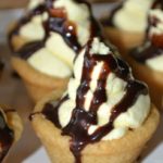 boston cream pie cookies cups drizzled with chocolate syrup