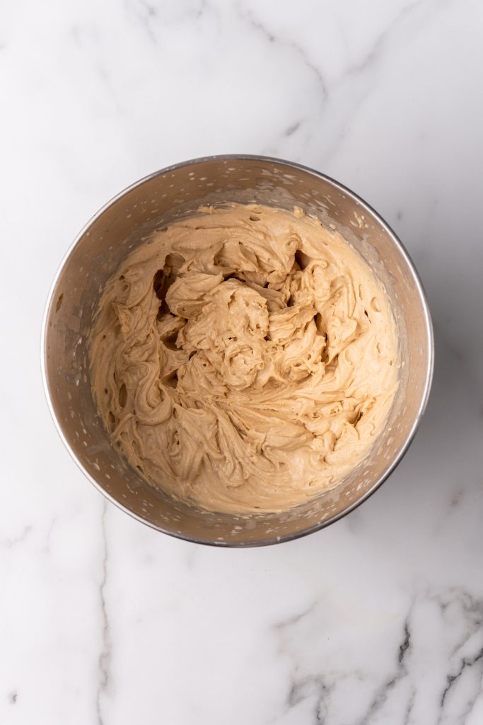whipped peanut butter mousse in the metal bowl of a stand mixer