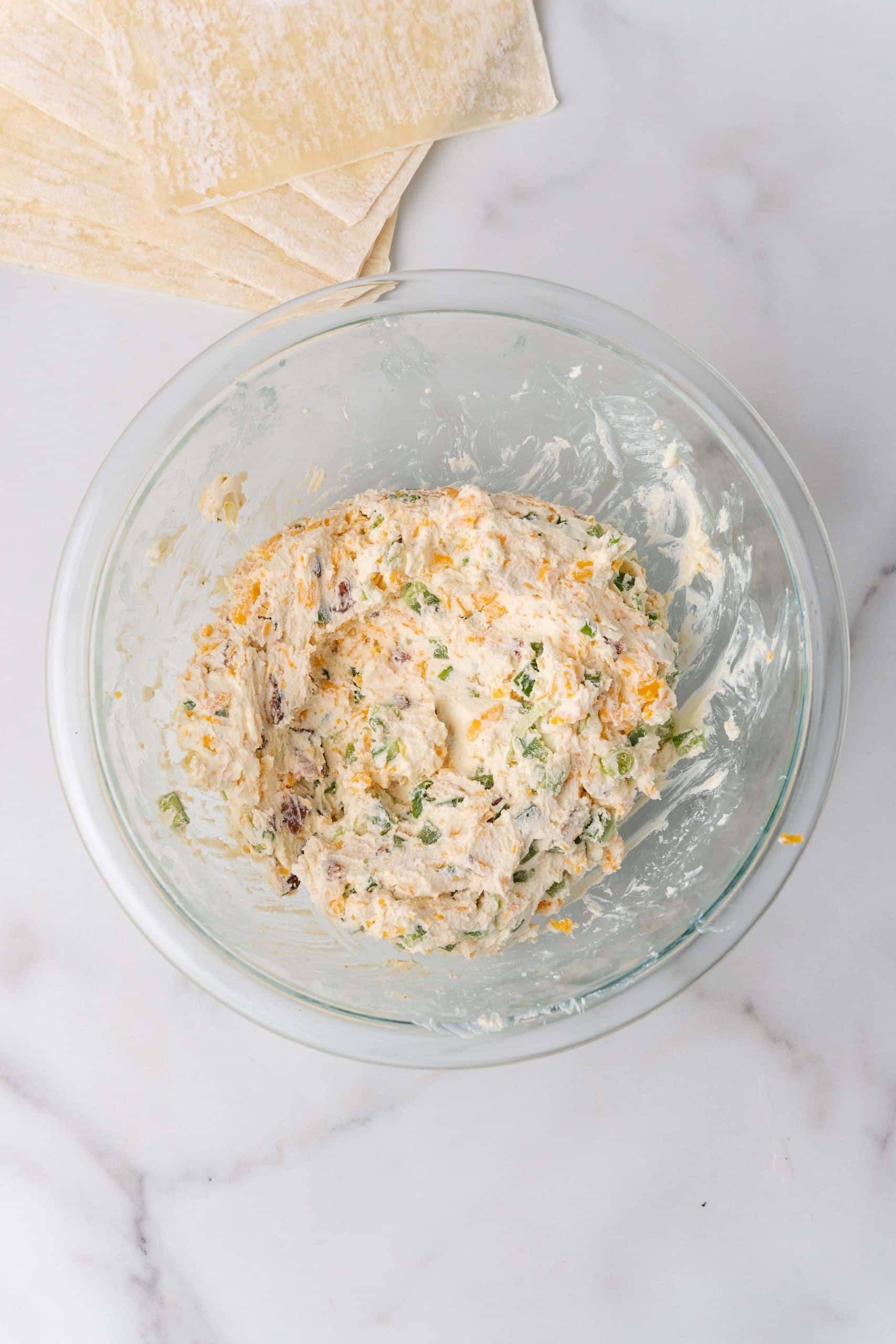 jalapeno popper cream cheese filling in a small glass mixing bowl