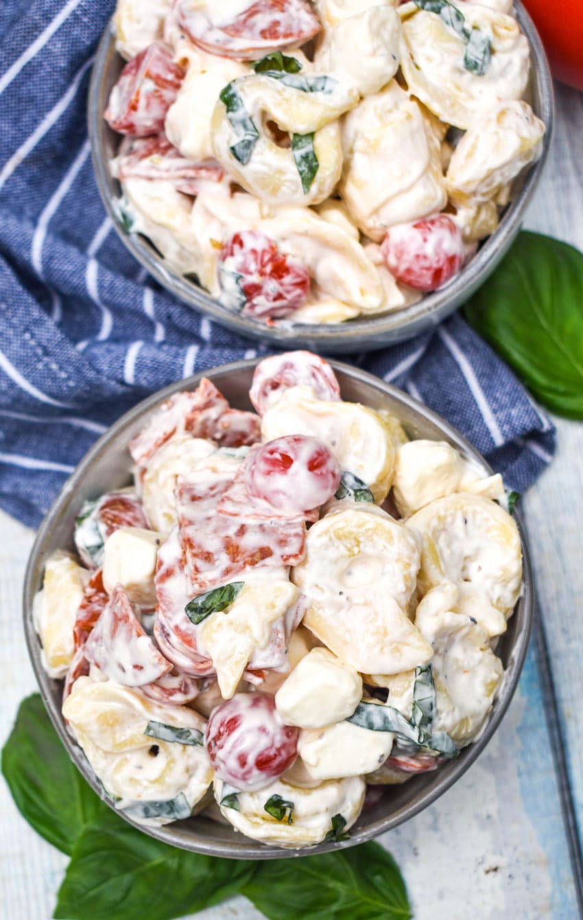 pepperoni basil tortellini salad in two small gray bowls