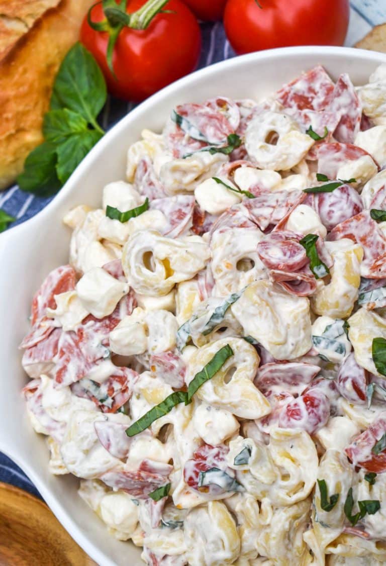pepperoni basil tortellini salad in a large white serving bowl