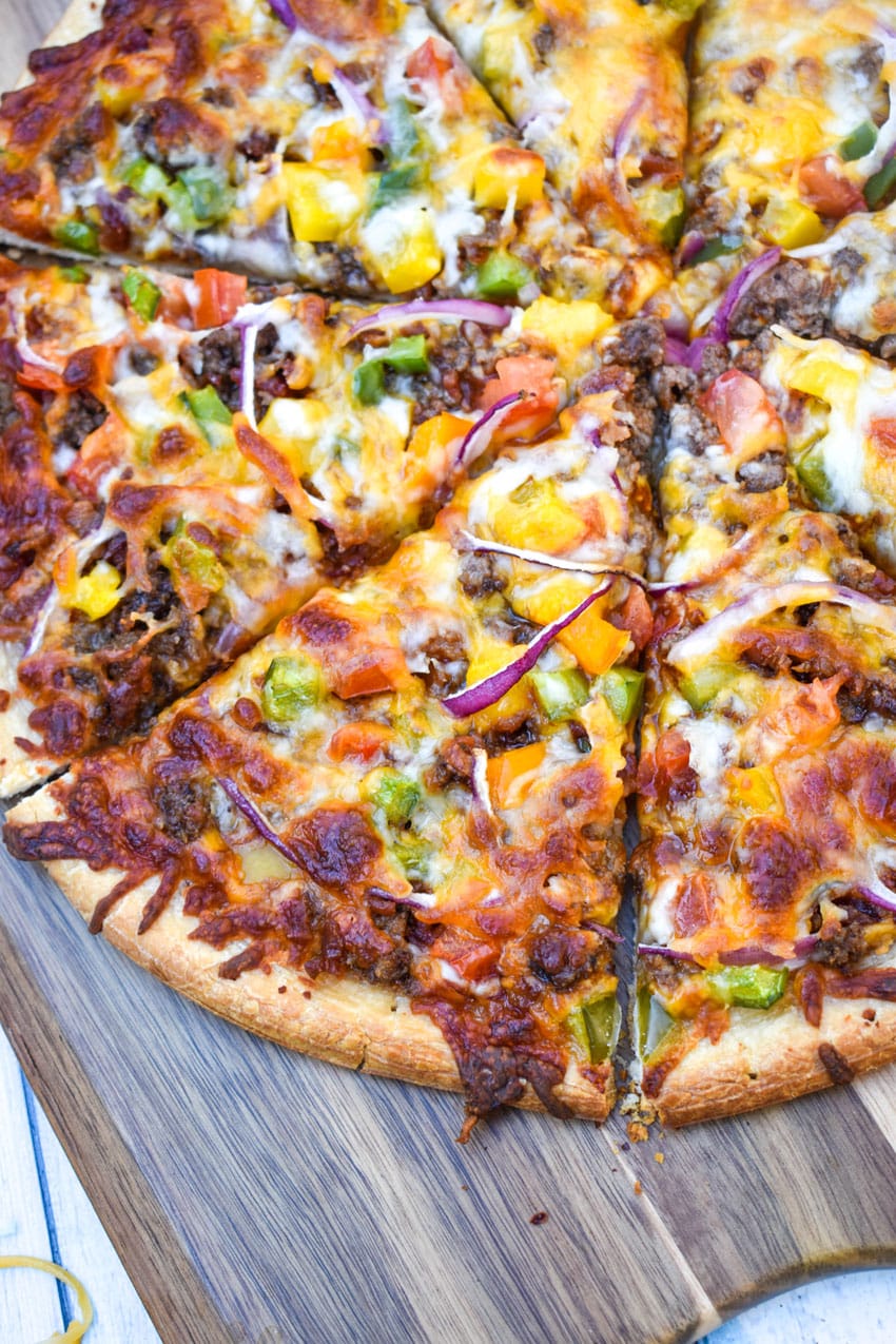 slices of roadhouse pizza on a wooden pizza peel