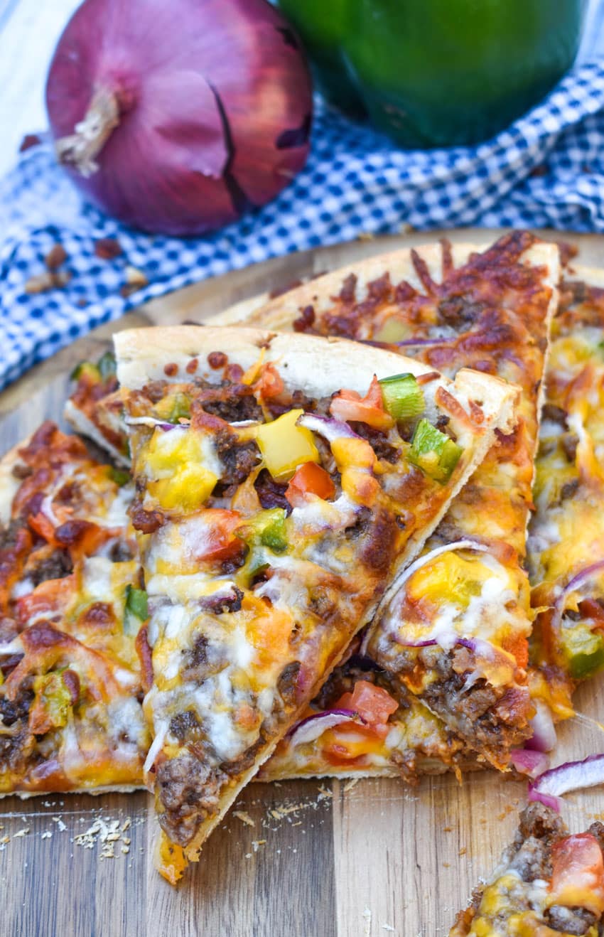 slices of roadhouse pizza on a wooden pizza peel