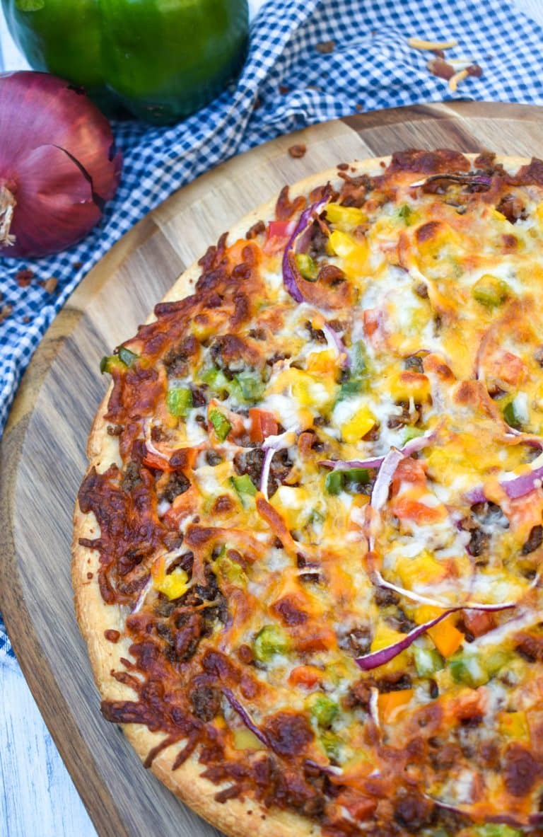 roadhouse pizza on a wooden pizza peel