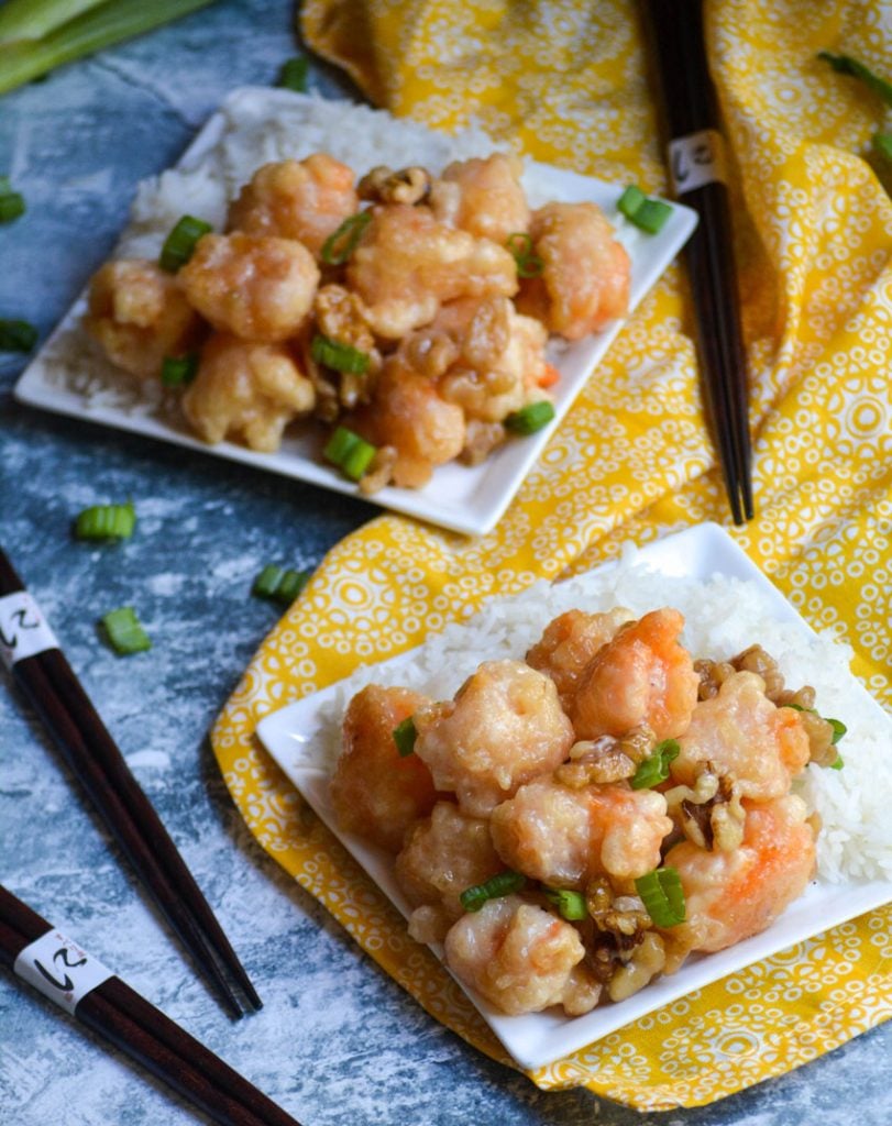 crispy honey walnut shrimp served alongside steamed white rice on a small white plate