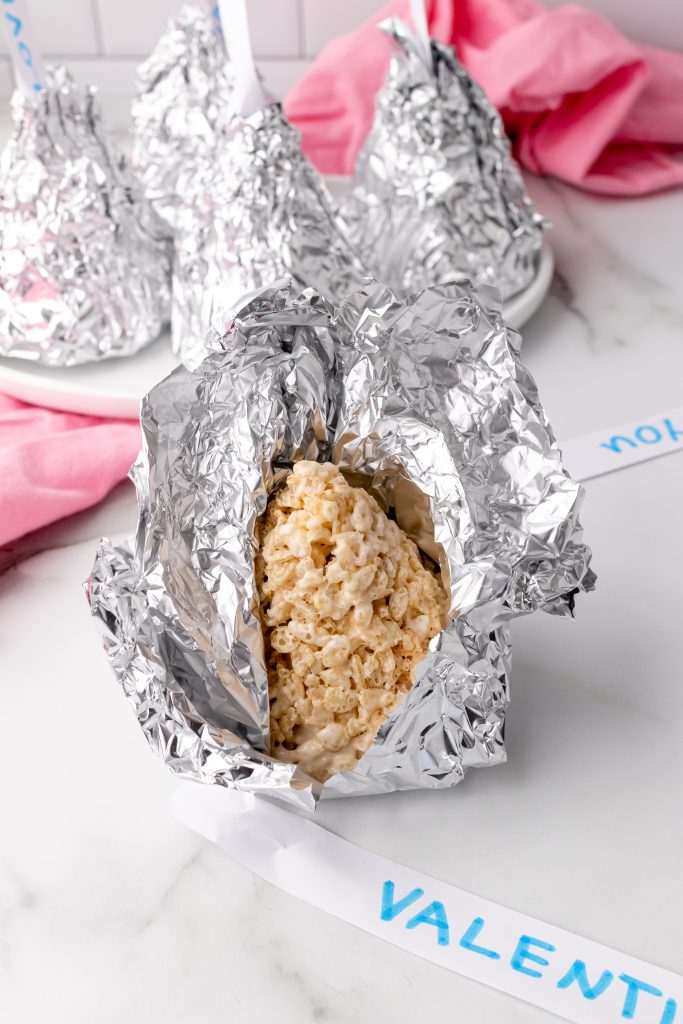 hershey's kiss rice krispie treat being unwrapped from foil
