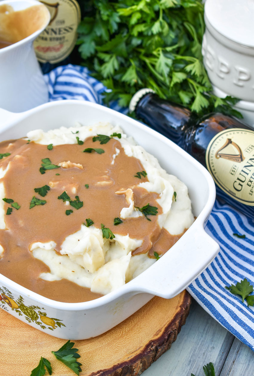 rich dijon stout gravy over a bowl of whipped mashed potatoes