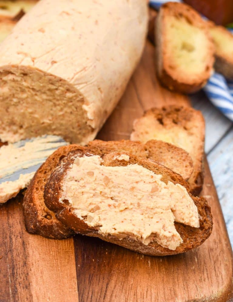 homemade sriracha honey flavored butter spread on a crispy crostini