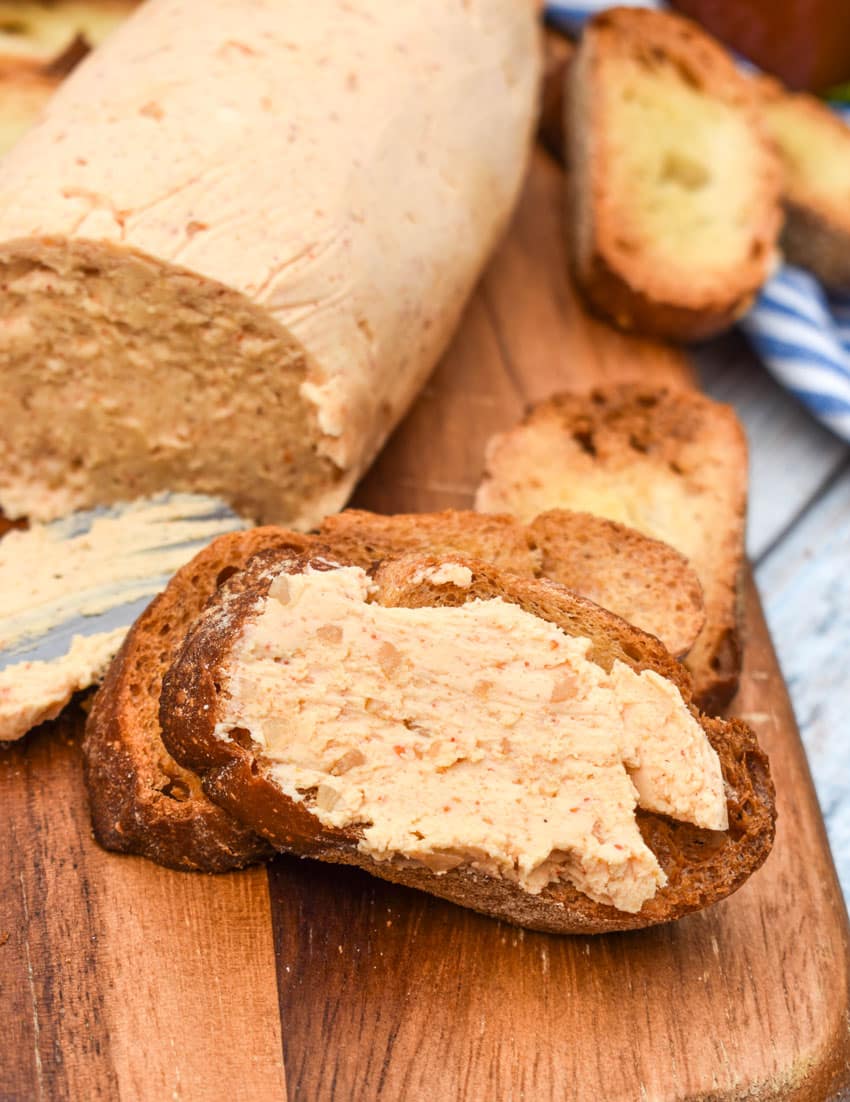 homemade sriracha honey flavored butter spread on a crispy crostini