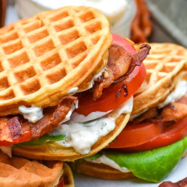 blt waffle wiches stacked on a metal tray