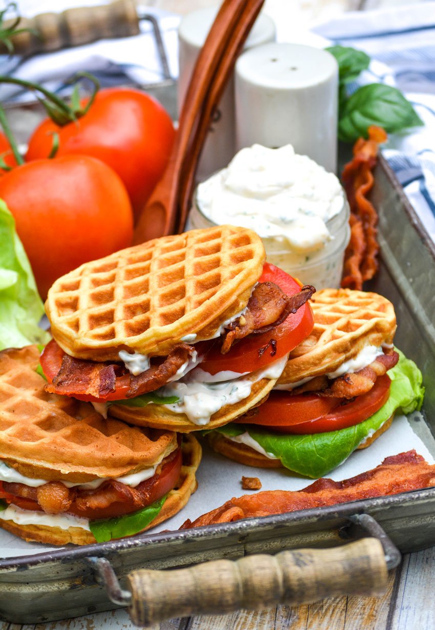 blt waffle wiches stacked on a metal tray