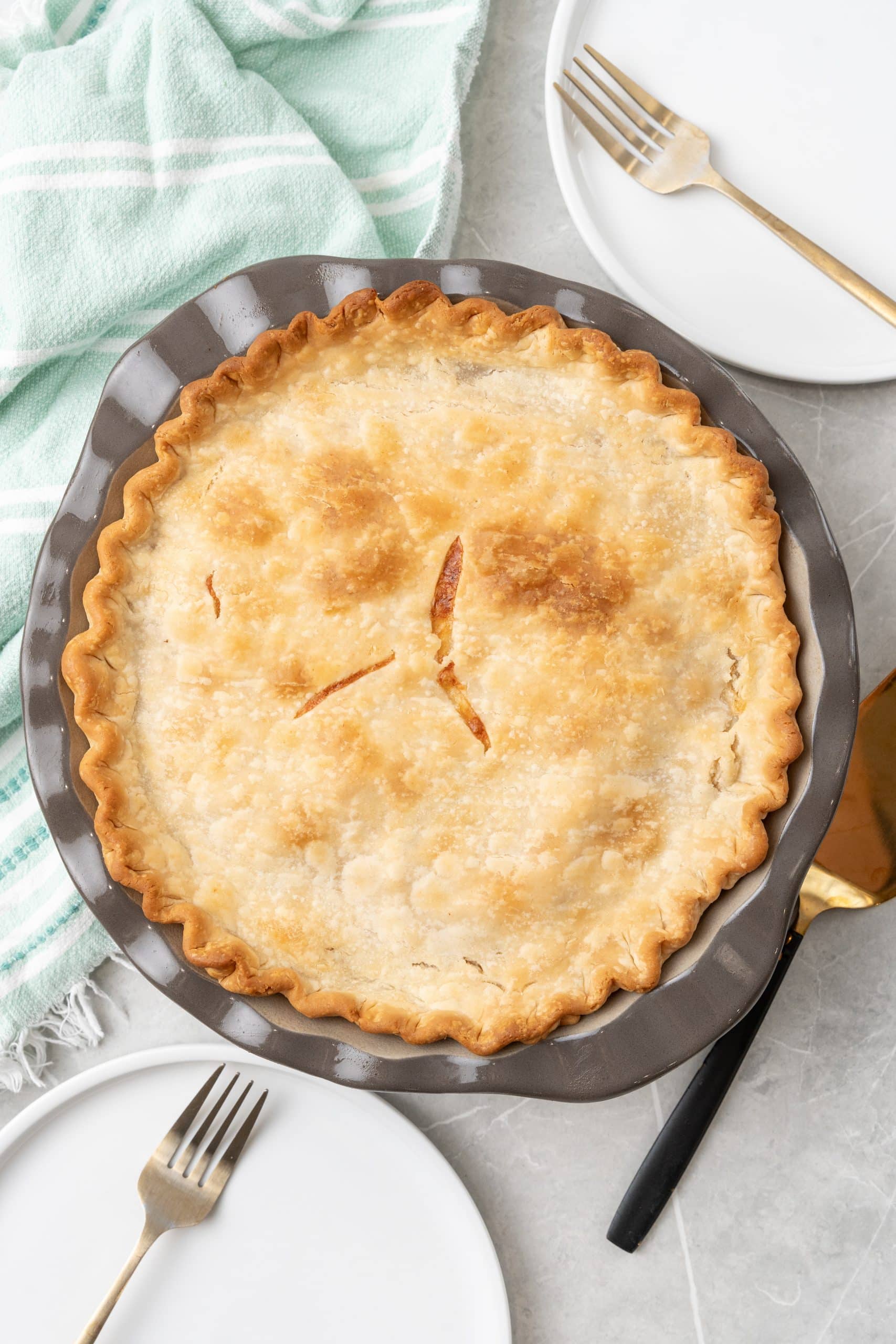 a baked seafood pot pie in a metal pie pan